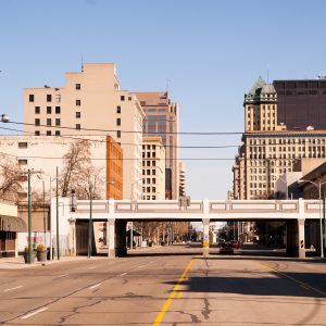 The streets and buildings of Dayton, Ohio only have a few travelers early Sunday morning