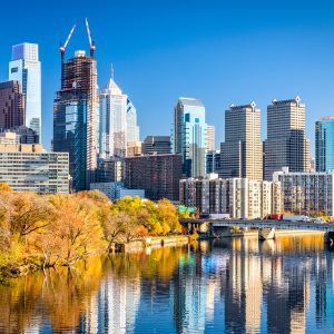 Philadelphia, Pennsylvania, USA downtown skyline on the river in autumn.