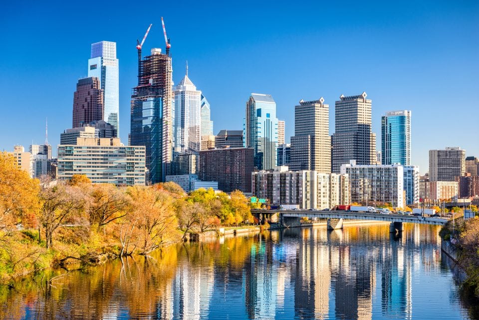 Philadelphia, Pennsylvania, USA downtown skyline on the river in autumn.