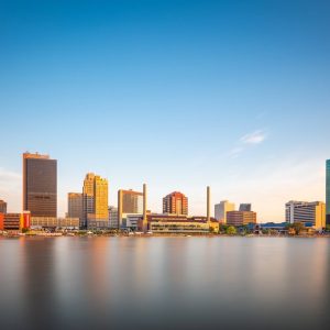 Toledo, Ohio, USA downtown skyline on the Maumee River at dusk.