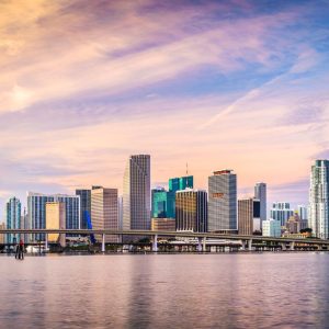 Miami, Florida City Skyline From The Water With Bridge And Cruise Ship